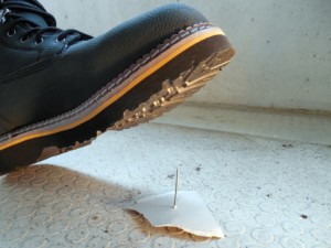 workplace safety statistics boot stepping over nails